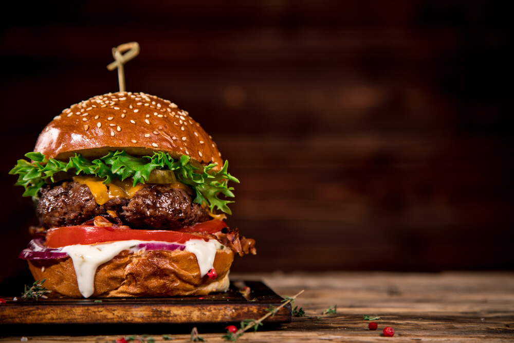 Close up of Home Made Tasty Burger on Wooden Table
