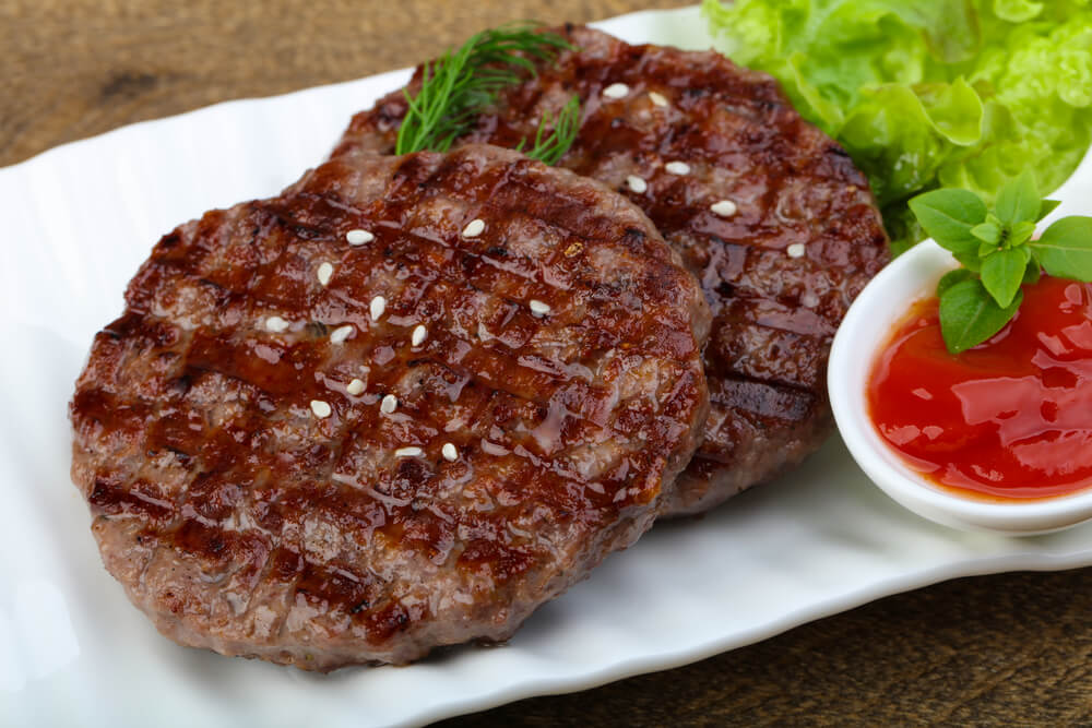 Grilled Burger Cutlet With Onion and Salad Leaves