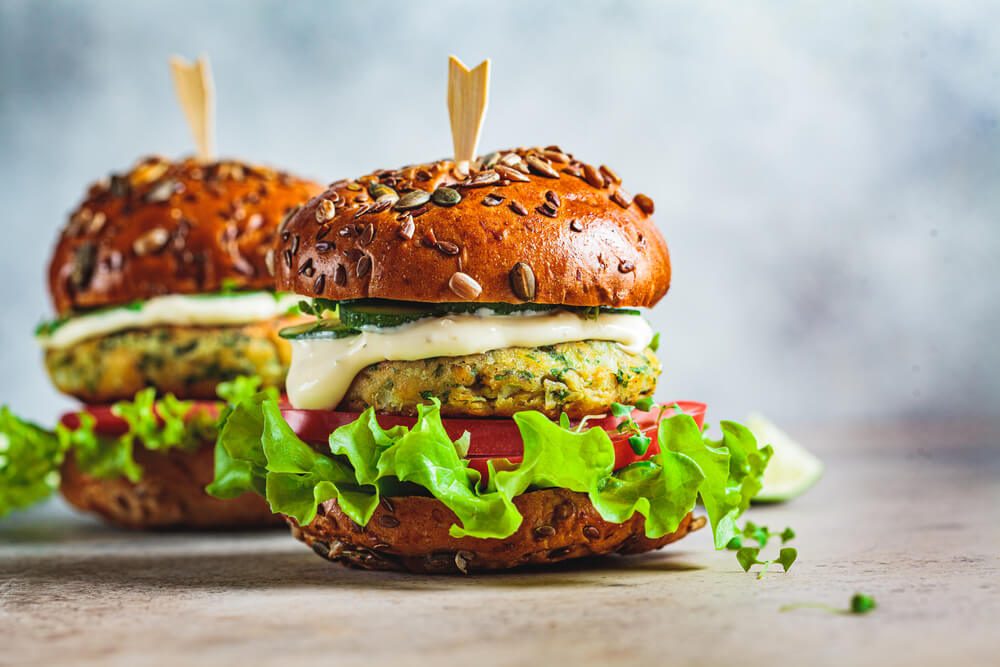Vegan Falafel Burger With Vegetables and Sauce Dark Background