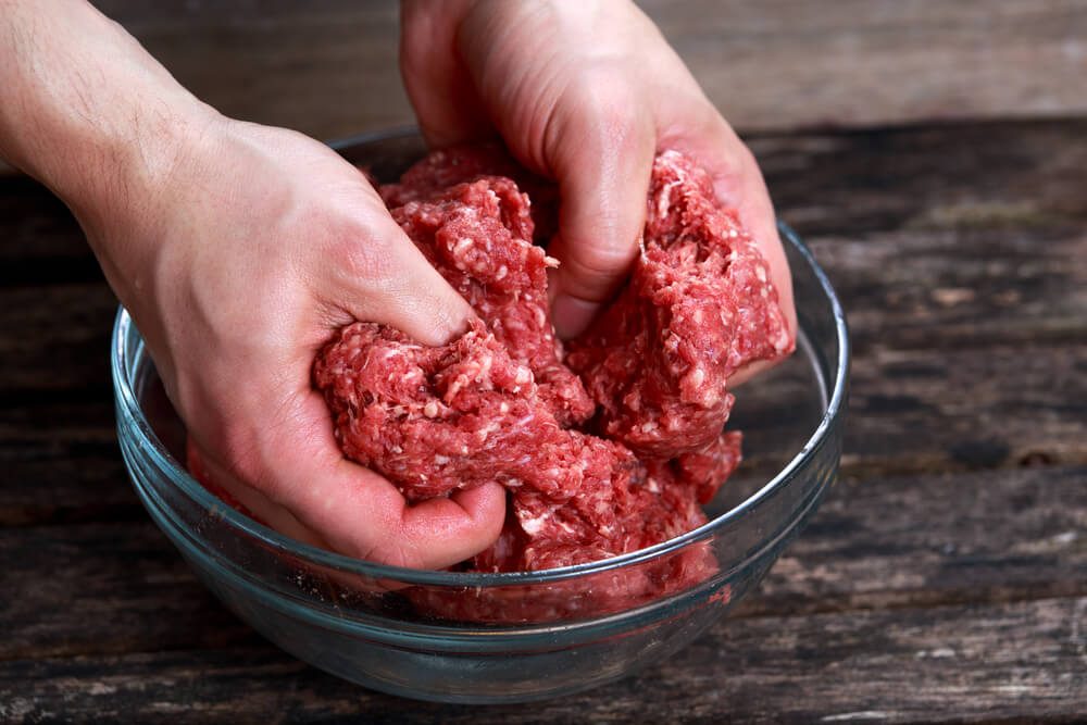 Man Mix Beef Mince by Hand