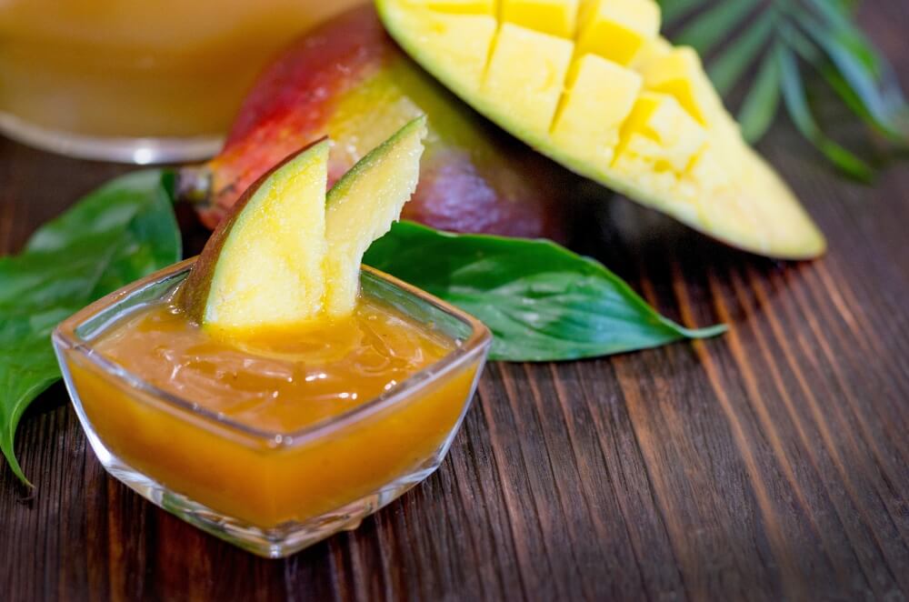 Fresh Sauce, Mango Fruit Dressing in a Glass Dish on the Table