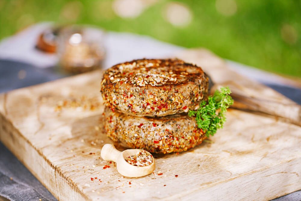 Lamb Burgers Spiced By Mint And Lamb Rub On Wooded Board