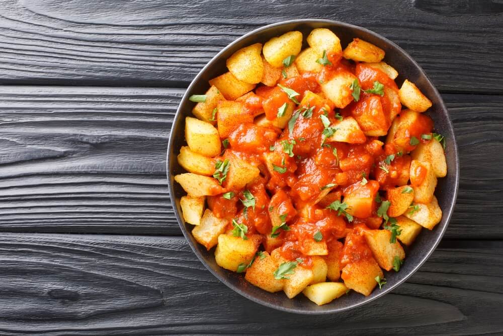 Patatas Bravas Recipe Fried Potatoes With Bravas Sauce Close Up In The Plate On The Table Horizontal Top View From Above